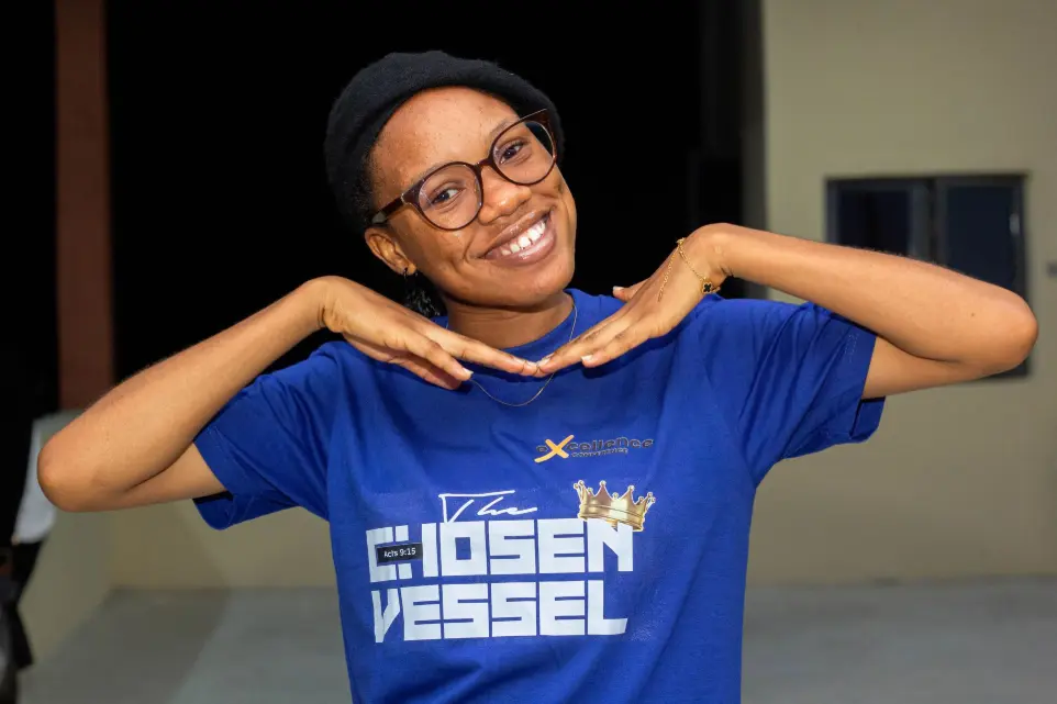 Girl posing during a Chapel conference in Chapel of Praise