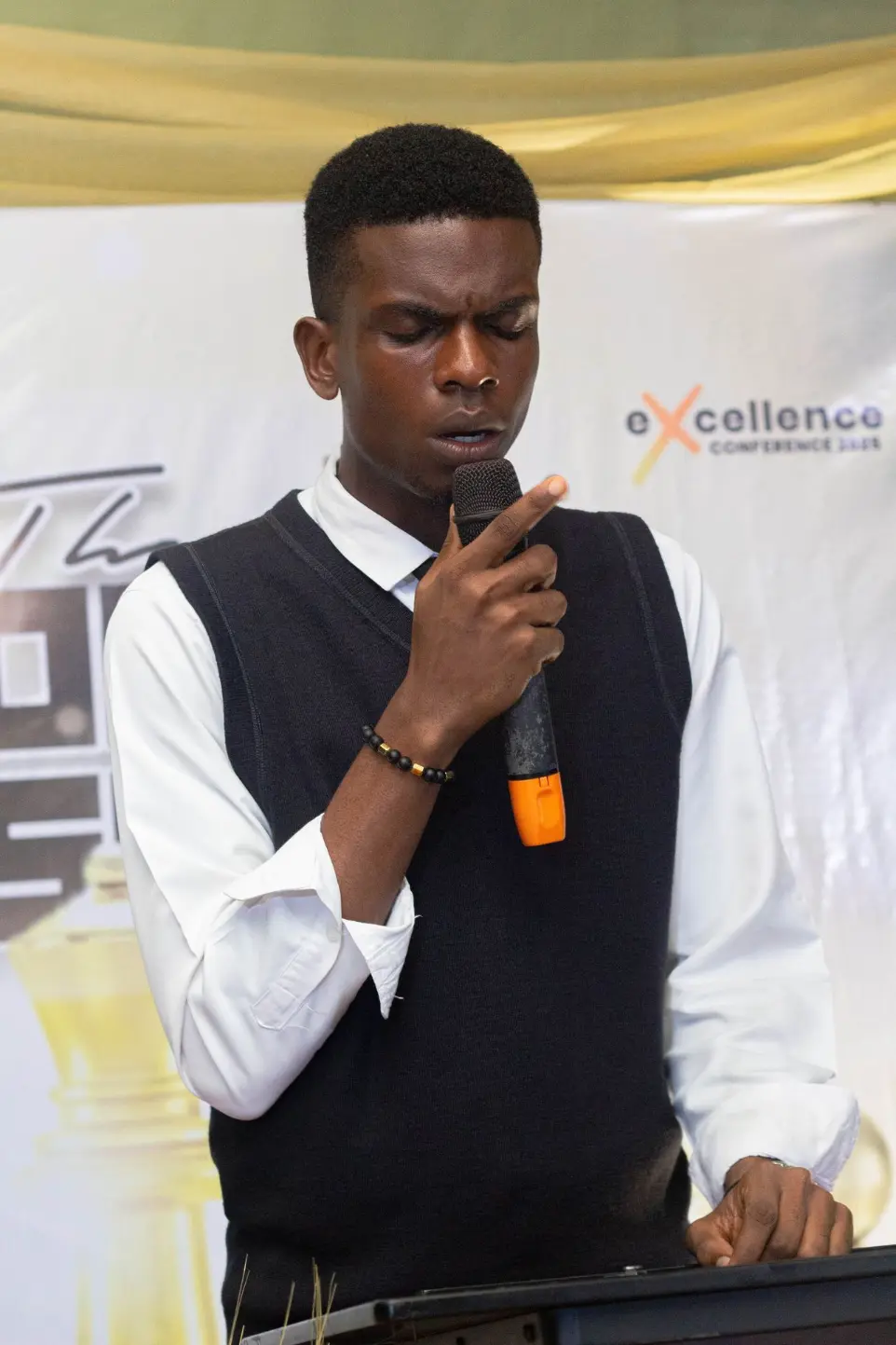 Boy leading worship session during a chapel service