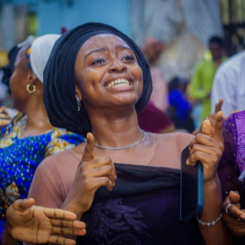 Girl dancing during Sunday service at Chapel of Praise