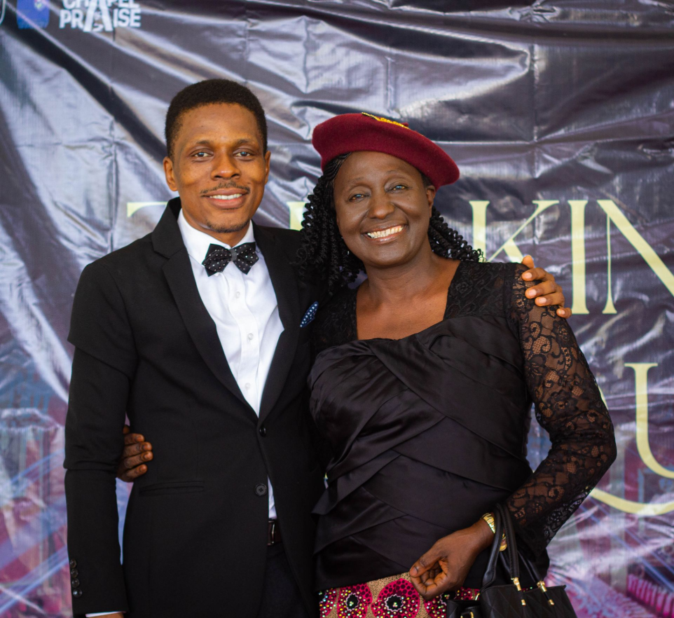 A man hugging a woman for a photo during a chapel event